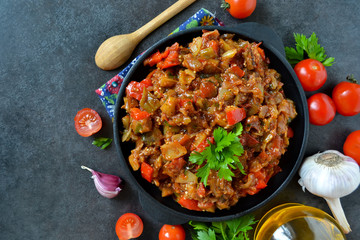 vegetable stew of eggplant on a black background, grilled vegeta