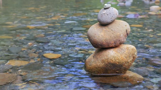 Calmness and relaxation concept. Tranquil nature scene of balanced wet stones