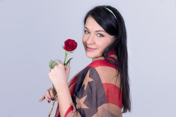 American girl holding a red rose 