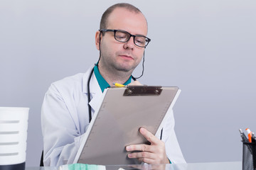 Doctor writing down 