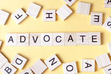 Advocate word written on wood block. Wooden Abc