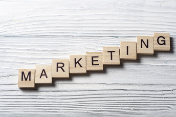 Marketing word write wooden cube on table