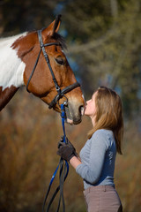Fototapeta premium Girl sportswoman and her horse in the spring