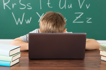 Little Boy In Classroom