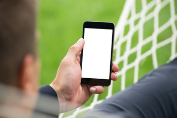 Person's Hand Holding Mobile Phone With Blank Screen