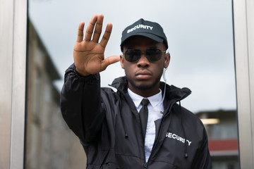 Obraz premium Security Guard Making Stop Gesture