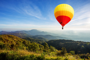 Colorful hot air balloon over mountain