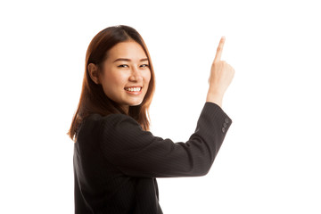 Back of Asian business woman touching the screen with her finger