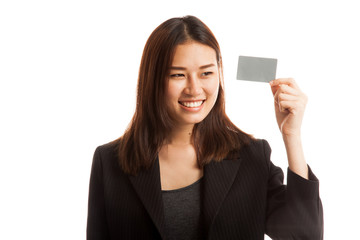 Young Asian business woman think with a blank card.