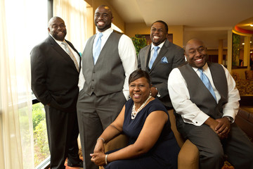 Mother and father and adult children. Groom. Family portrait. 