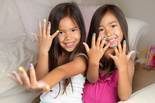 Little girls with painted nails.