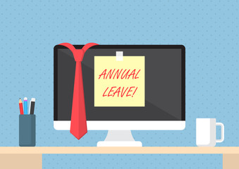 Sticky note with word annual leave on monitor
