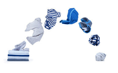 clothes fly out of pile and falls down isolated on white backgro