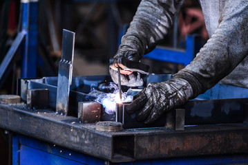 Arc welding of a steel in factory