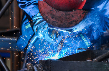 Arc welding of a steel in factory