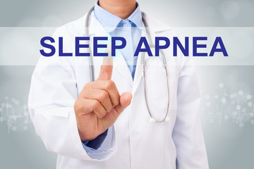 Doctor hand touching sleep apnea sign on virtual screen. medical concept