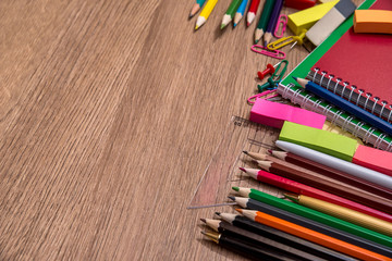 Obraz premium different school supplies on a wooden table