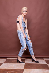 Woman in bra and jeans posing fashion