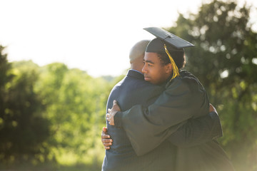 African American father and son at graduation.