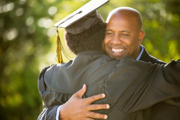 African American father and son at graduation.