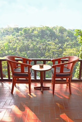 Two chair on the balcony, view of tropical tree