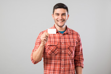 Man showing blank business card