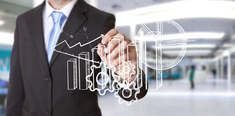 Businessman drawing chart