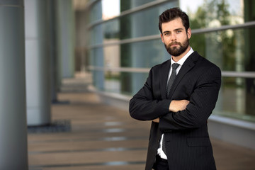 Strong confident pose arms crossed bearded attractive executive stylish masculinity 