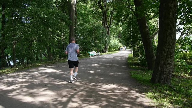 Man running in the park. slow motion