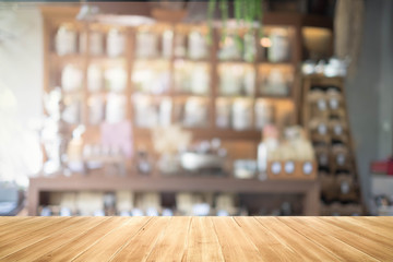 Empty wood table and blurred coffee shop background. product display