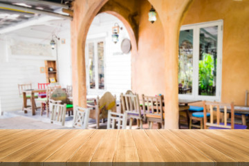 Fototapeta na wymiar Empty wood table and blurred coffee shop background. product display