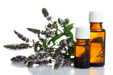 Jars of aromatic oils on isolated background. The concept of aromatherapy