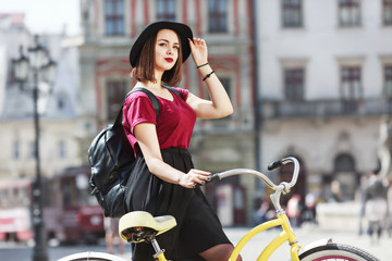 Fototapeta na wymiar Nice girl riding a bicycle