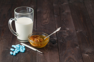 Temperature measurement with toy bear. Health warm tea for flu p