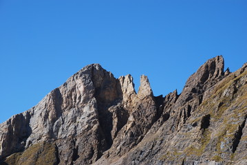 Rock cliff blue sky Swiss alps