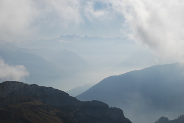 Misty view mountains Swiss alps