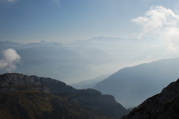 Misty and cloudy view mountains Swiss alps