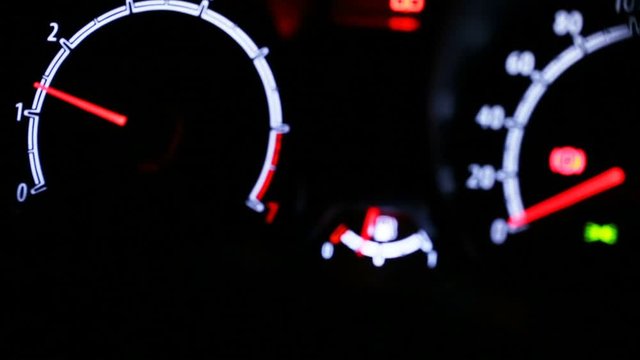Car instrument panel illuminated at night