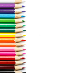 Colored pencils on white background