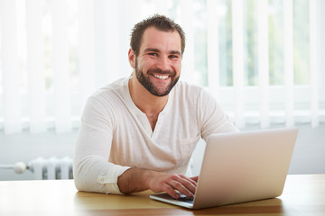 Fototapeta premium Happy man working with laptop