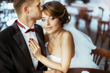 Lovely married couple sitting in cafe