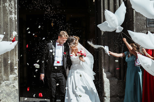 Bride And Groom Going Out Of Church