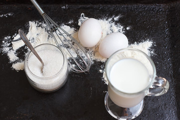 Ingredients for a cake on black stone