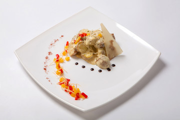 Baked in their skins potatoes with a creamy sauce.