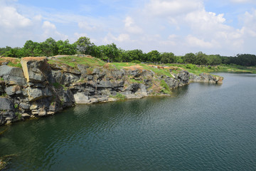 rocky lake with stone and cliff