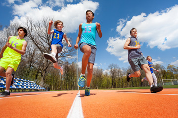 Teenage athletes having fun on the racetrack