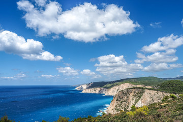 Zakynthos cliff panorama with clear water, blue sky and white cl
