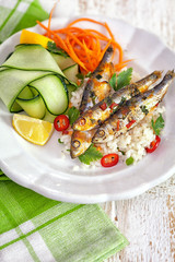 Grilled sardines with vegetables on rice
