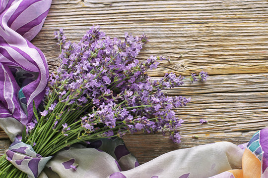 Bouquet Of Lavender With  Silk  Scarf On Wooden Table 