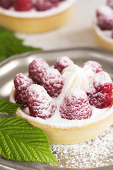 Sweet small tarts with fresh raspberry